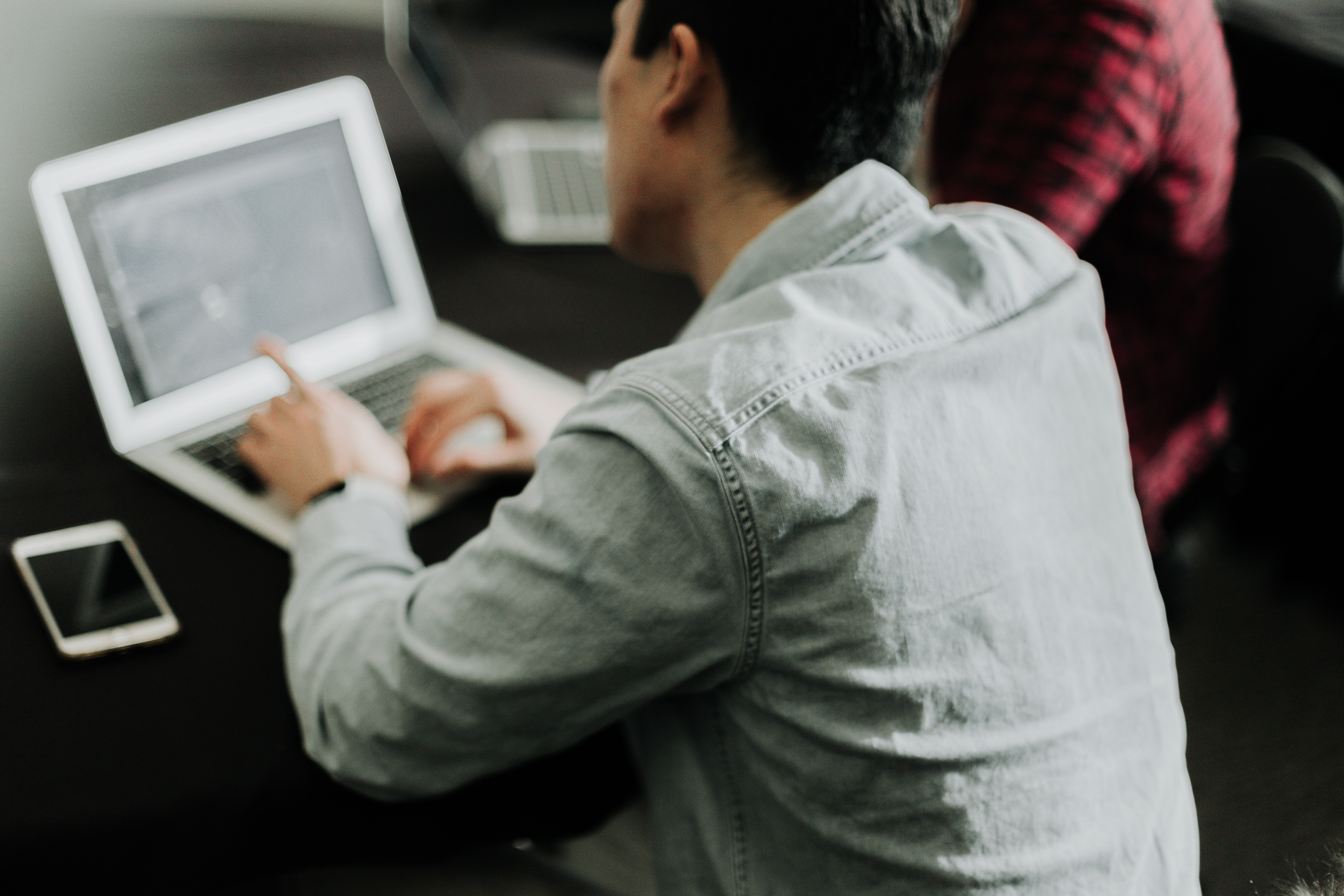 Person looking at laptop