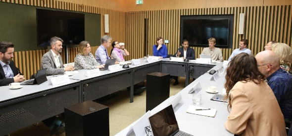 People sat around a table at a round table event
