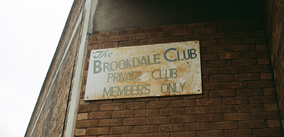 A sign for the Brookdale Club
