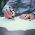 Image showing a man signing his contract