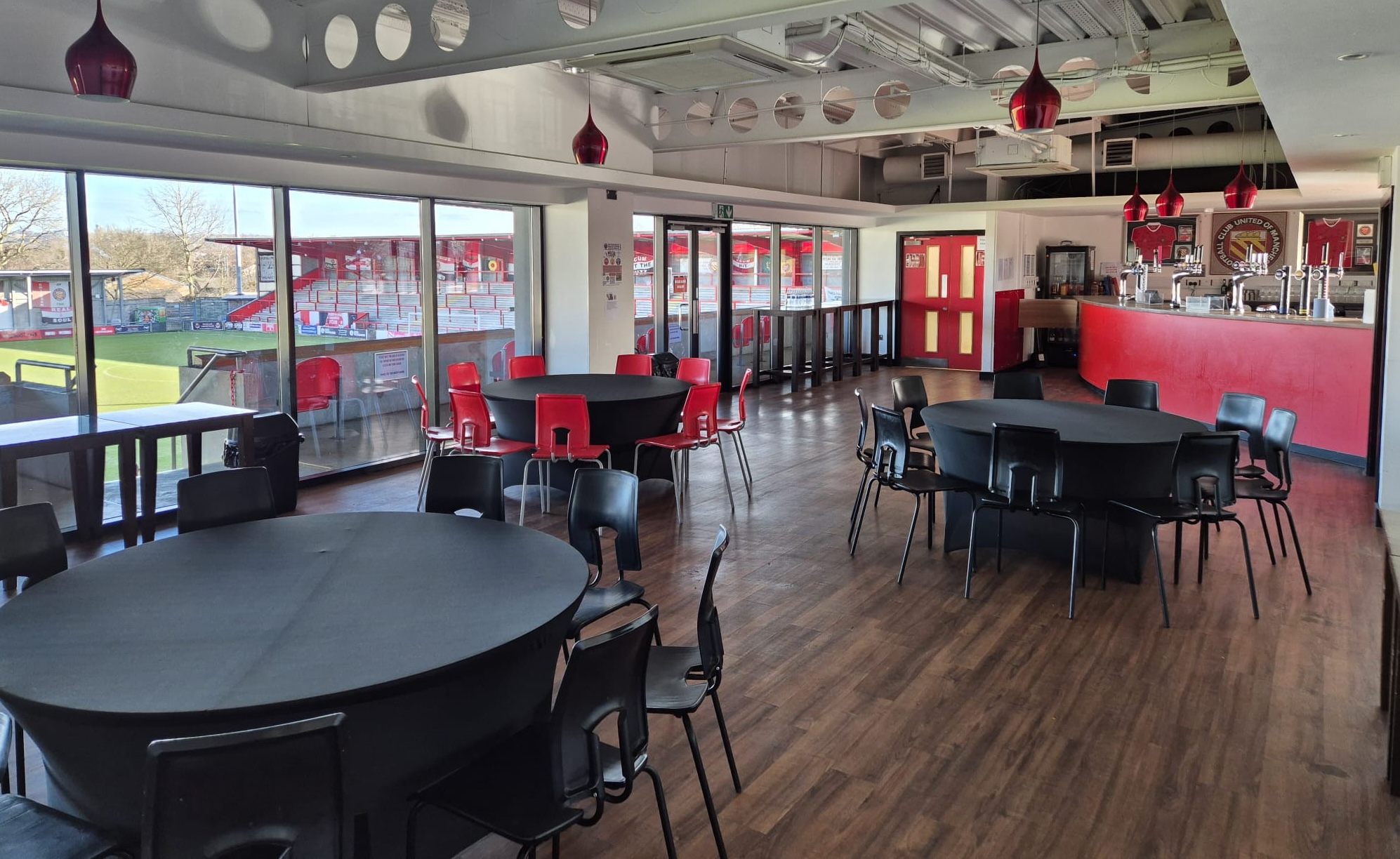 Tables and chairs in one of the rooms for hire at FC United
