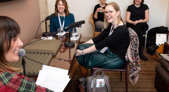Two women being interviewed for podcast