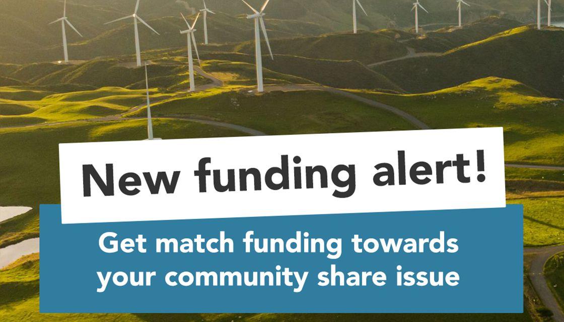 Promotional banner featuring a group of wind turbines on a green hillside with the text 'new funding alert! get match funding towards your community share issue.'