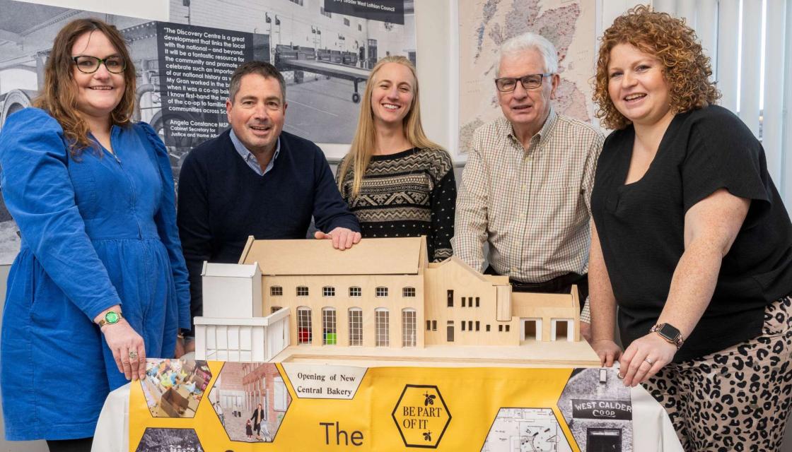 People stand with a model of the soon to be redeveloped Scottish Co-operative Discovery Centre