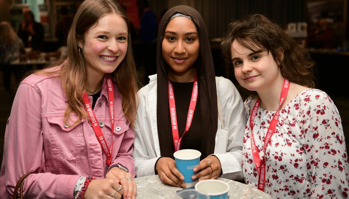 Three smiling attendees at the National Youth 