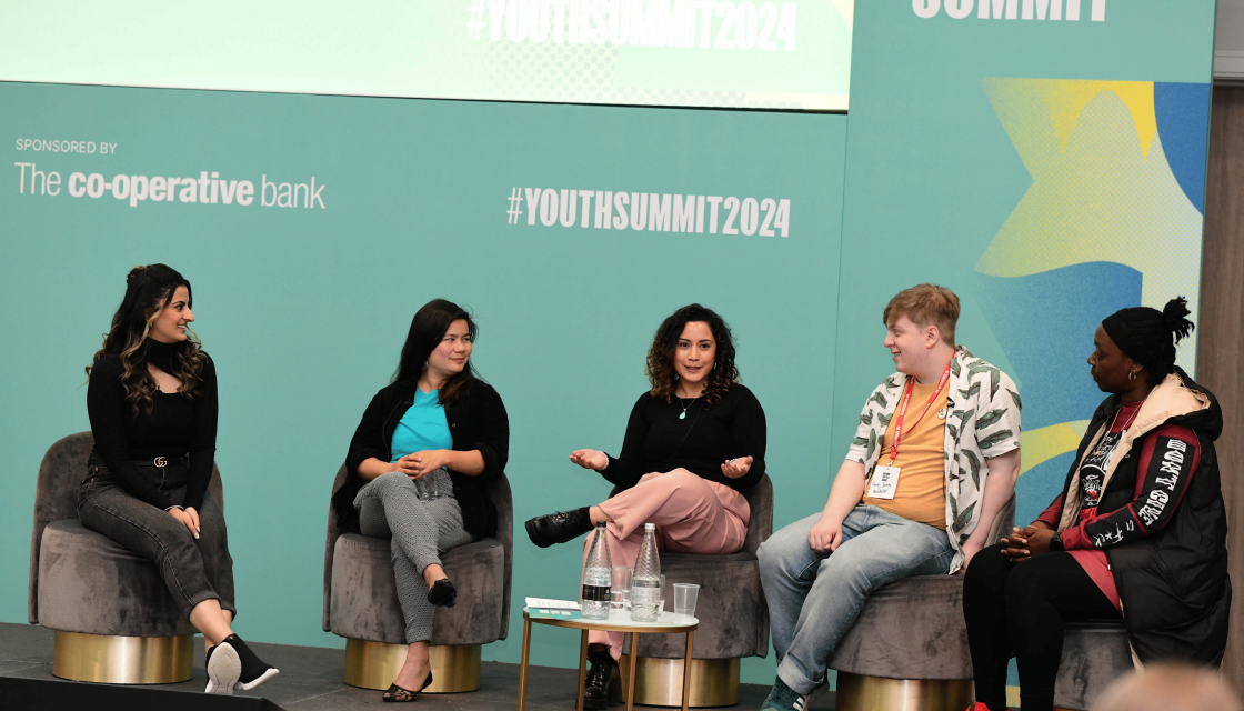 Five young panelists on stage at the National Youth Summit 2024