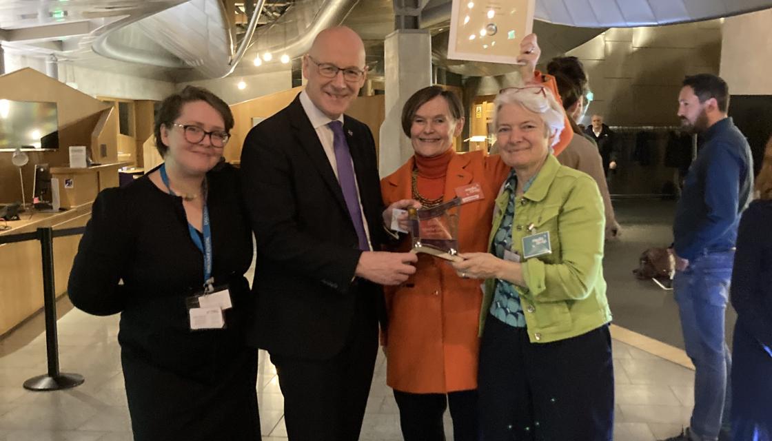 A photograph of Media Co-op worker owners alongside Scotland First Minister John Swinney