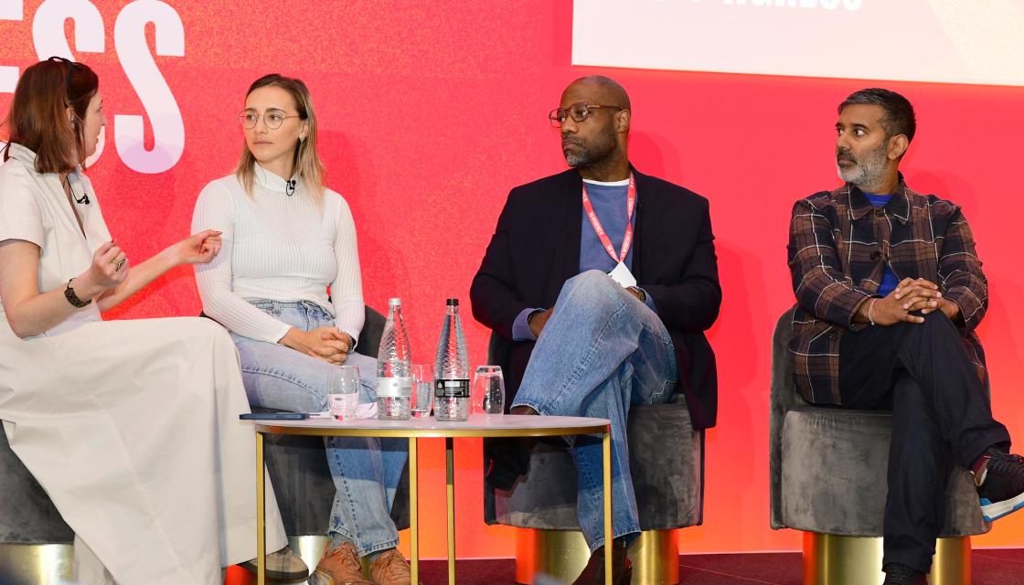 A panel of people on the main stage at Co-op Congress 2024