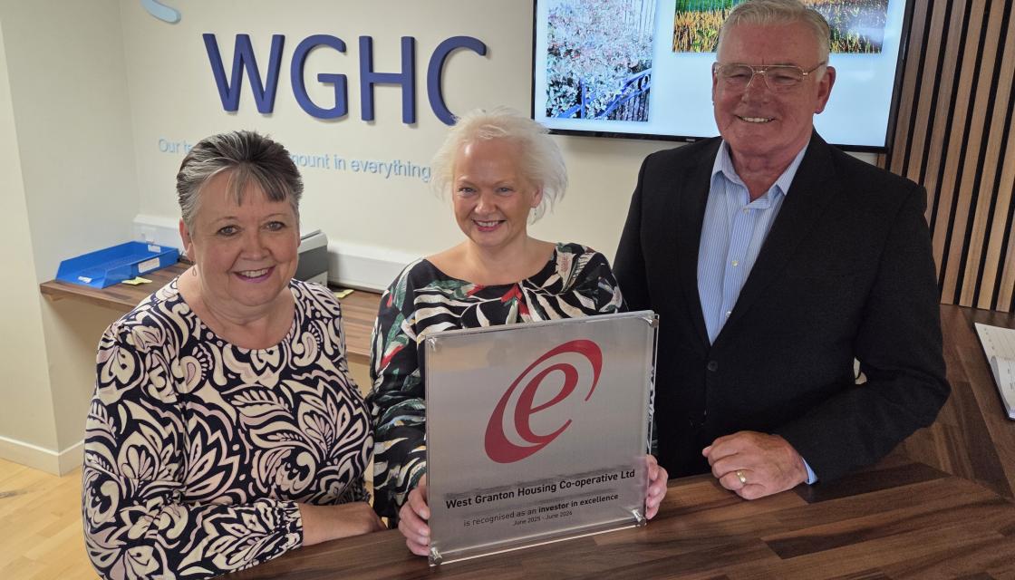 A photograph of (pictured left to right): Investors in Excellence CEO, Judy Hart; West Granton Housing Co-operative (WGHC) CEO, Larke Adger; and WGHC Committee Chair, Colin Fraser