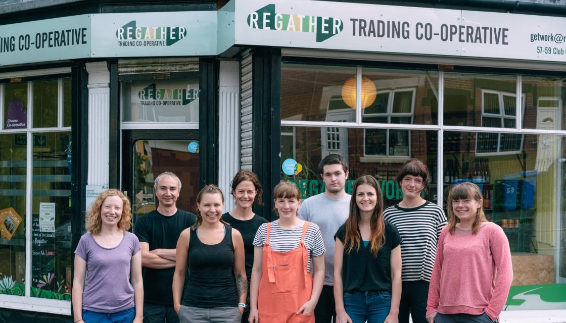 A team of people outside the Regather shop