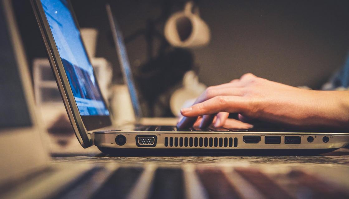Guy typing on computer