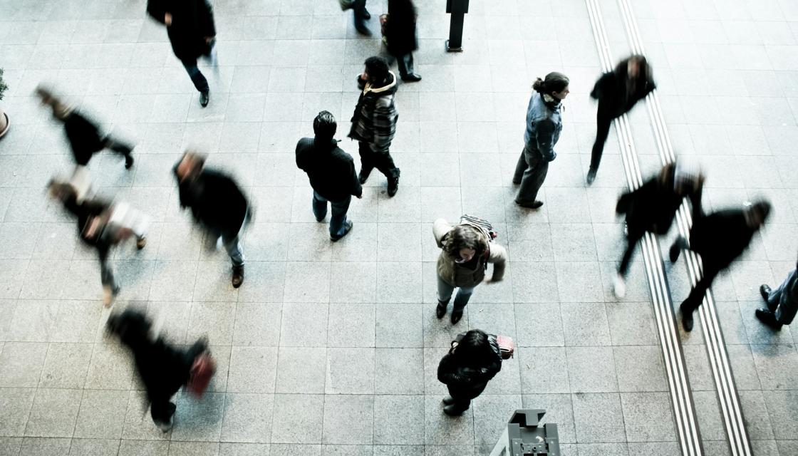 People walking on grey concrete