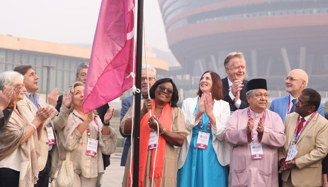 Rose Marley, CEO Co-operatives UK with ICA flag