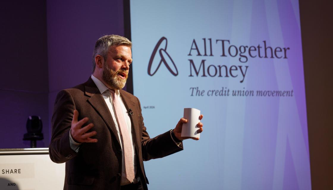 A photograph of Matt Bland, Chief Executive of All Together Money speaking at the organisation's rebrand event.
