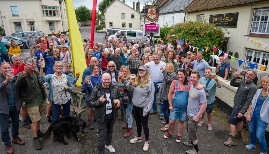 A picture showing people outside of the Drewes Arms pub