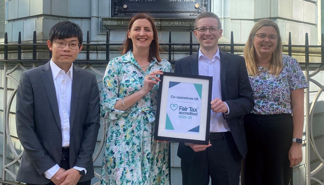 Rose Marley and others holding the Co-operative UK Fair Tax Mark Cerification 2022-23