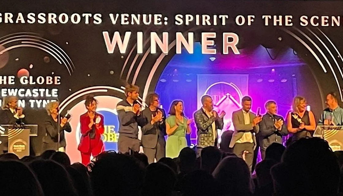 Tyneside’s community-owned music venue accepting an award.