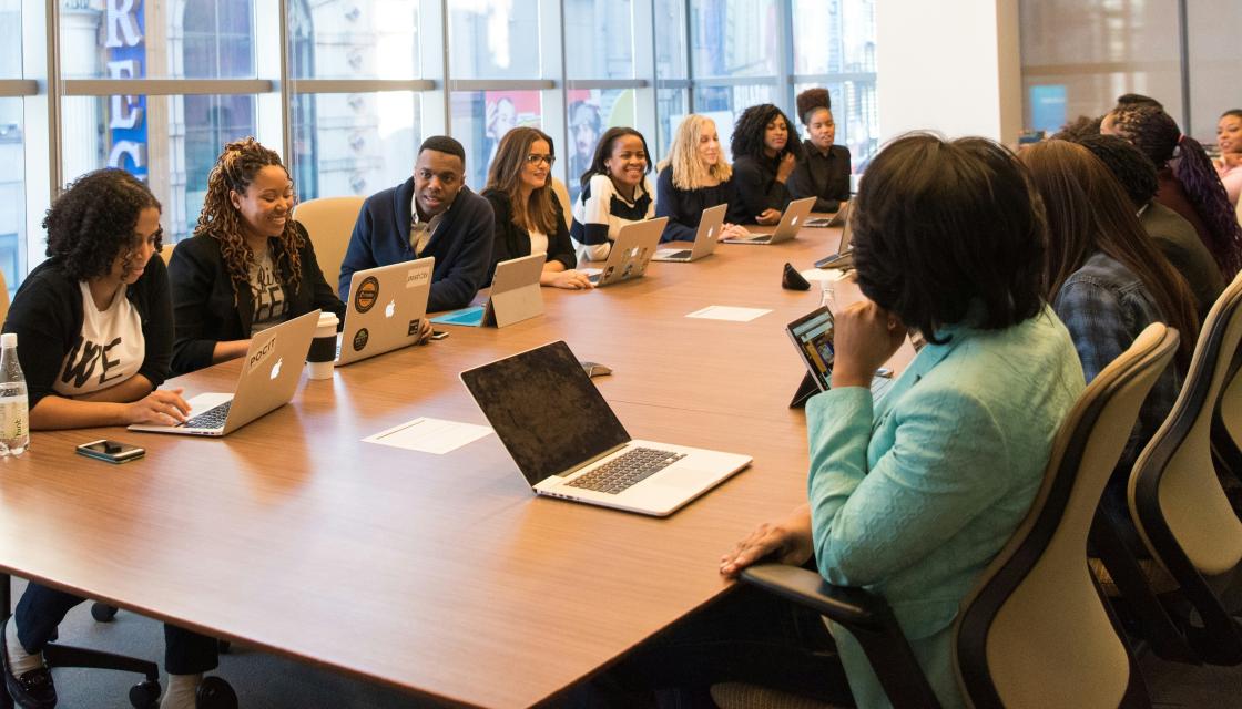 People sat around a board table