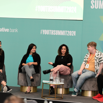 Five young panelists on stage at the National Youth Summit 2024