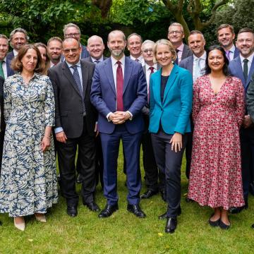 A photograph of leading figures from the co-operative and mutual sectors at a Downing Street reception.