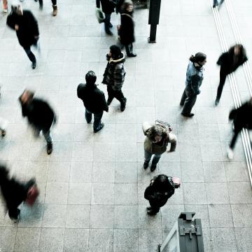 People walking on grey concrete