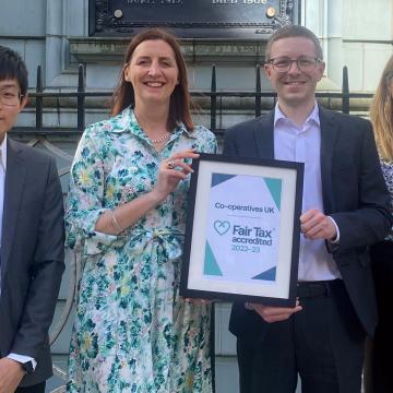 Rose Marley and others holding the Co-operative UK Fair Tax Mark Cerification 2022-23